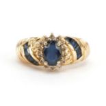14k gold sapphire and diamond flower head ring with sapphire set shoulders, the largest sapphire