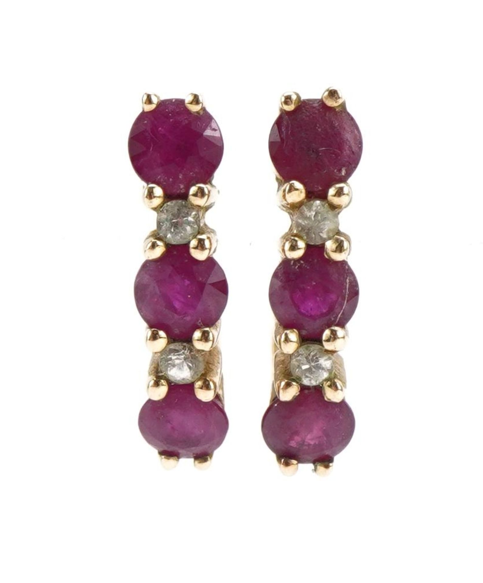 Pair of 9ct gold ruby and clear stone, half hoop stud earrings, the clear stones test as sapphire,