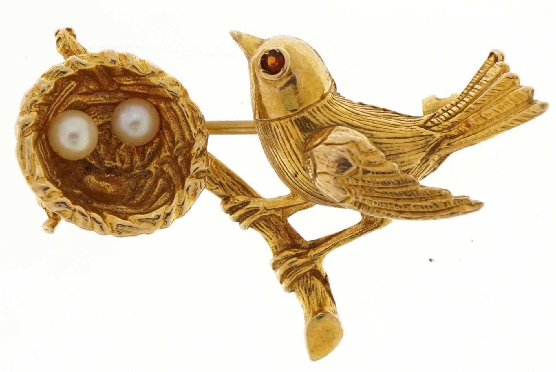 9ct gold bird and nest brooch with two pearl eggs and a red stone eye, 3.3cm wide, 5.0g : For