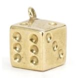 Unmarked gold dice charm, 8mm high, 0.7g : For further information on this lot please contact the