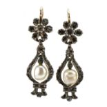 Pair of Victorian unmarked gold diamond and Baroque pearl flower head drop earrings, tests as 15ct