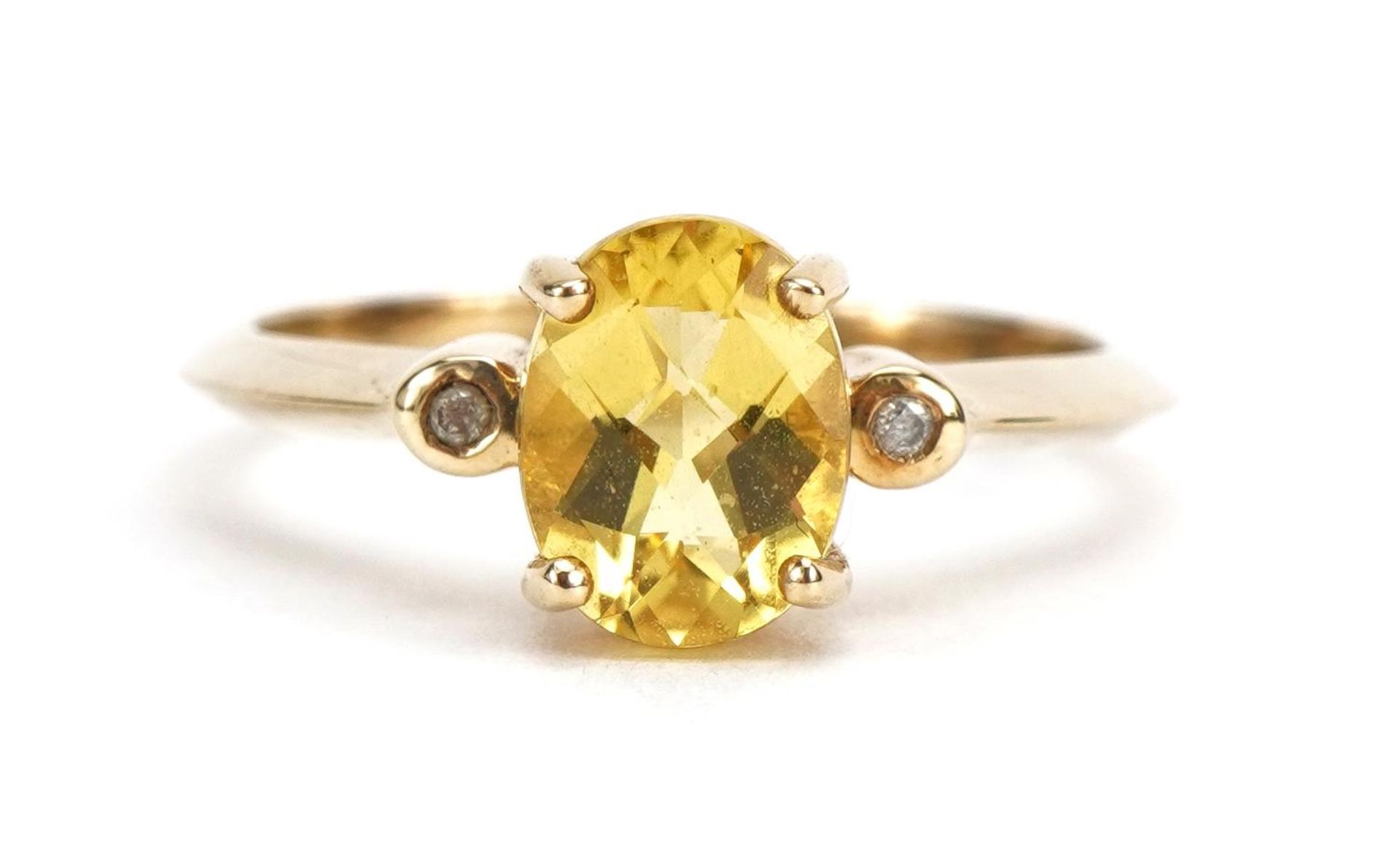 9ct gold citrine solitaire ring with diamond set shoulders, the citrine approximately 8.0mm x 6.1mm,