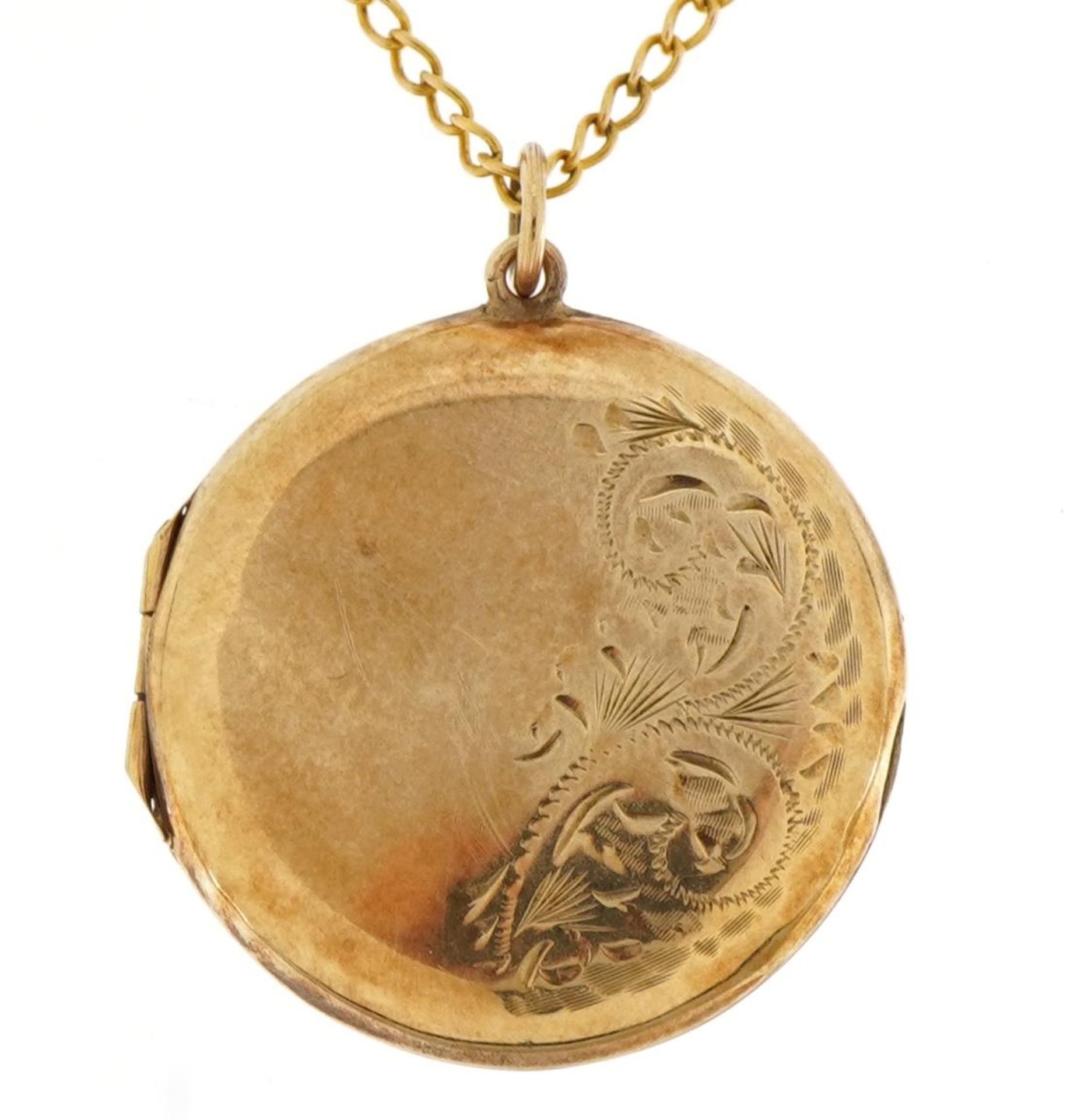 Circular 9ct gold locket with engraved decoration on a 9ct gold curb link necklace, 3.2cm high and