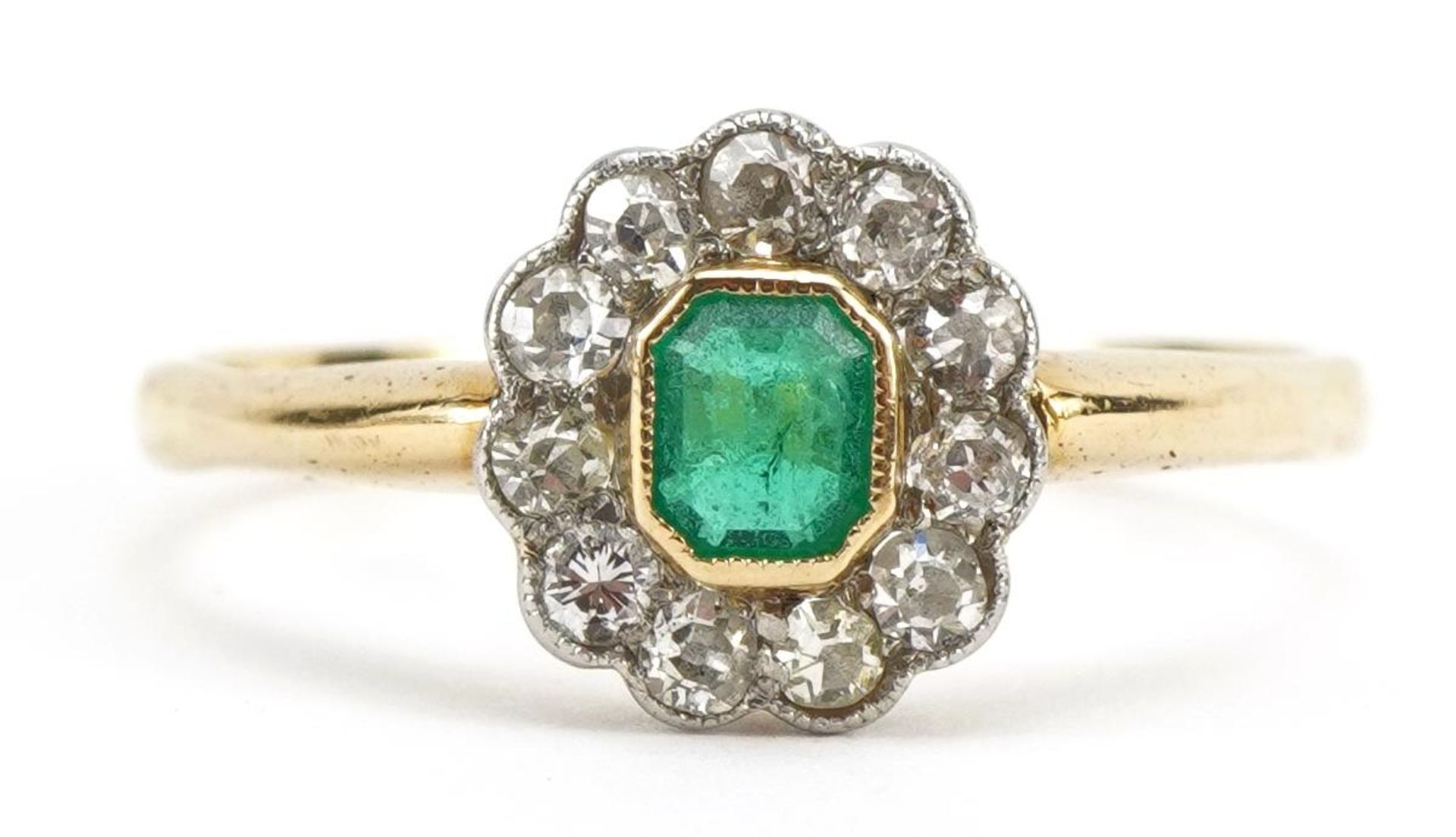 18ct gold emerald and diamond cluster ring, the emerald approximately 4.0mm x 3.2mm, size S, 2.