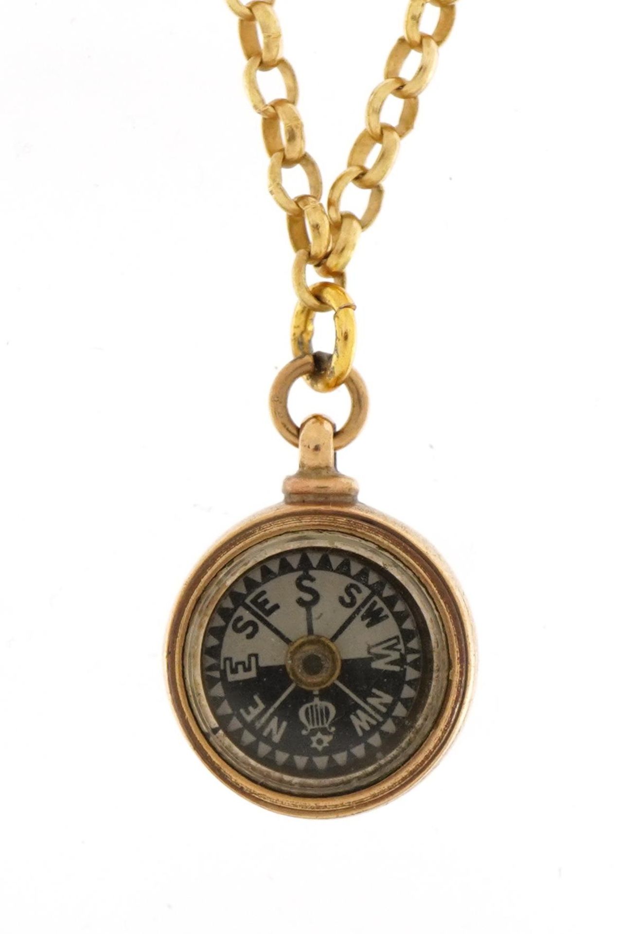 Unmarked gold compass pendant on a yellow metal Belcher link necklace, 2cm high and 37cm in