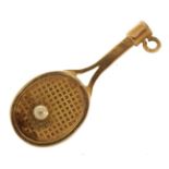 9ct gold tennis racquet and pearl ball charm, 2.5cm high, 1.4g : For further information on this lot
