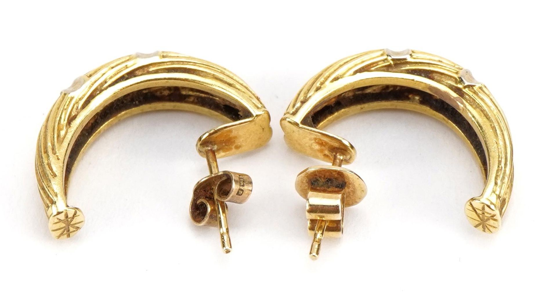 Pair of unmarked gold half hoop earrings, tests as 18ct gold, 2.1cm high, 7.4g : For further - Image 2 of 2