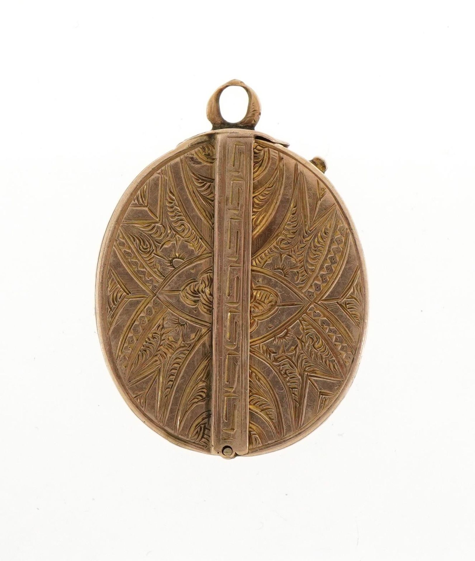 Unmarked gold oval folding locket with engraved floral and Greek key decoration, tests as 9ct