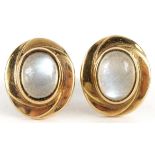 Pair of 9ct gold cabochon moonstone stud earrings, the moonstones approximately 7.9mm x 5.9mm, 1.3cm