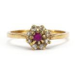 18ct gold ruby and diamond flower head ring, size O/P, 2.7g : For further information on this lot