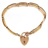 9ct gold three row gate link bracelet with love heart padlock, total 12.0g : For further information