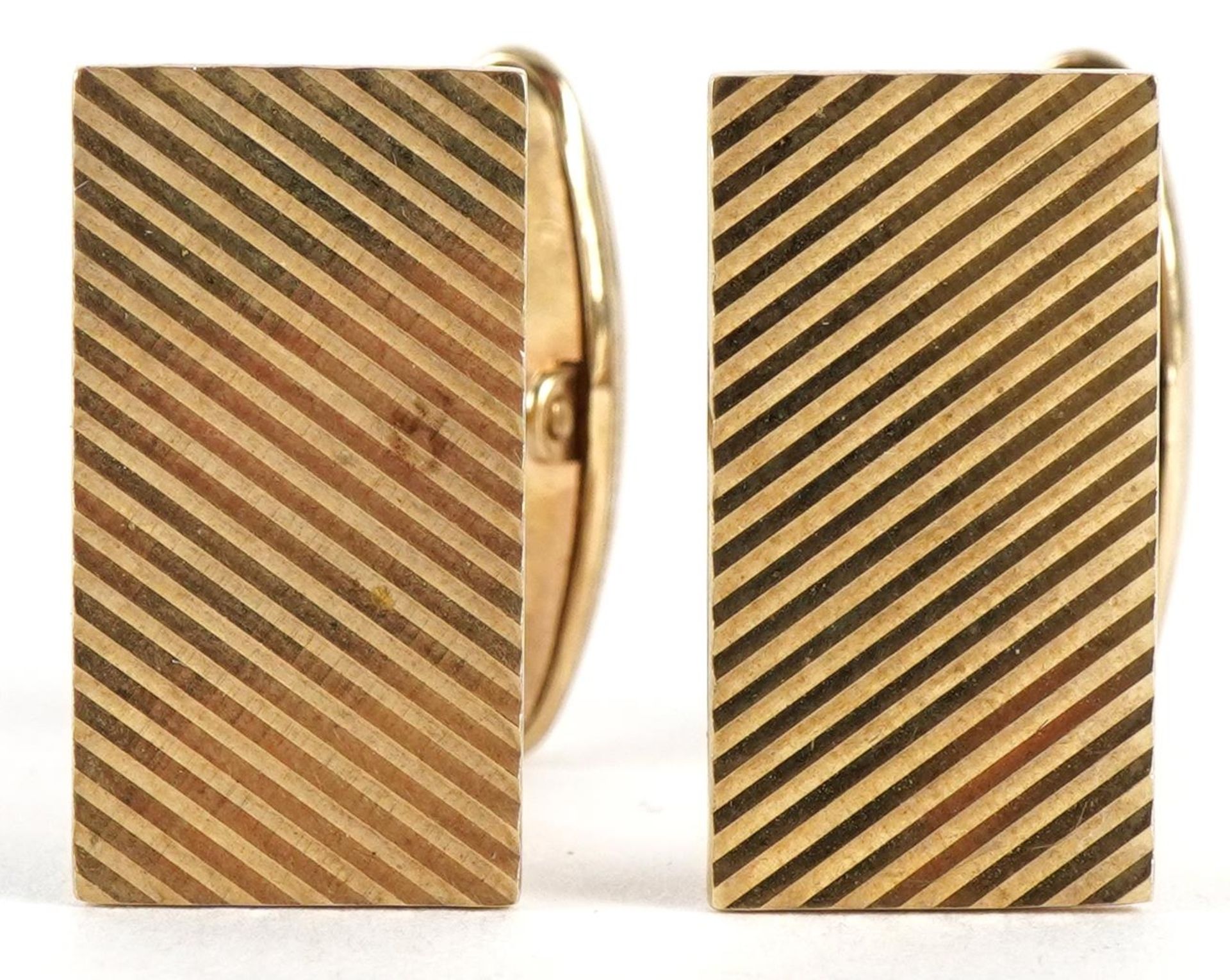 Pair of 9ct gold cufflinks with engine turned decoration, 2.0cm high, 7.6g : For further information