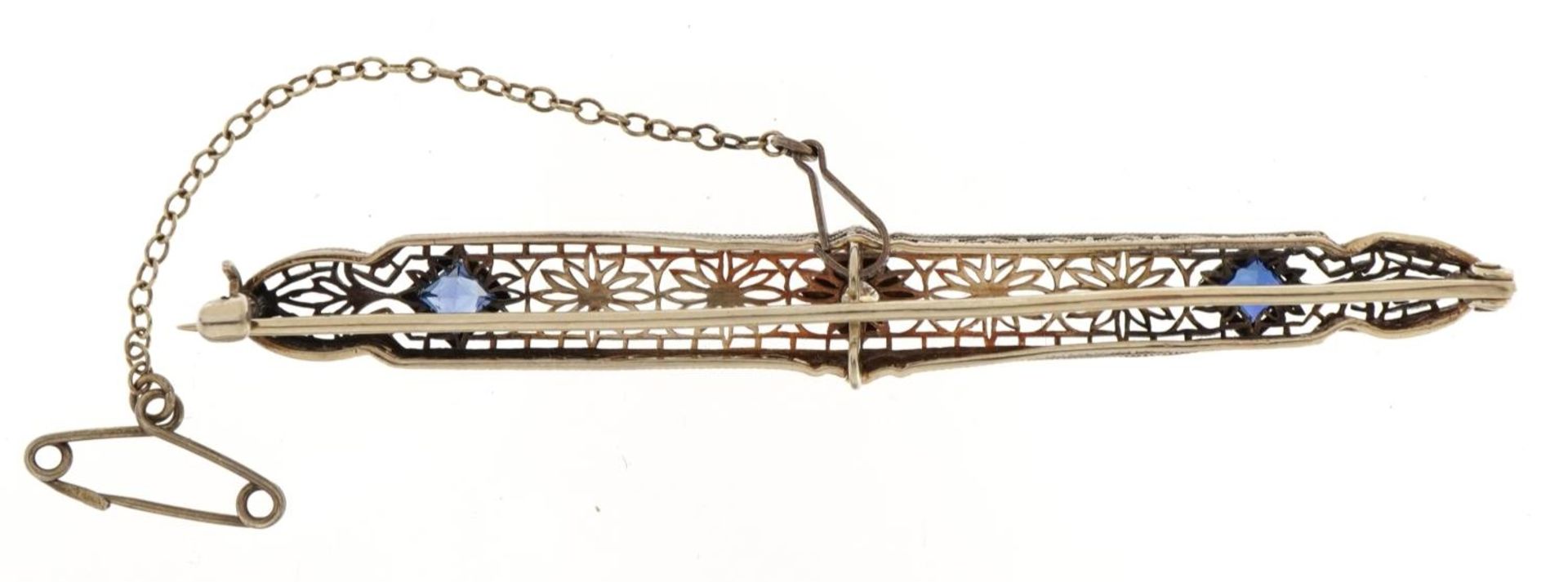 Art Deco unmarked white metal diamond and sapphire filigree bar brooch with safety chain, the - Image 2 of 2