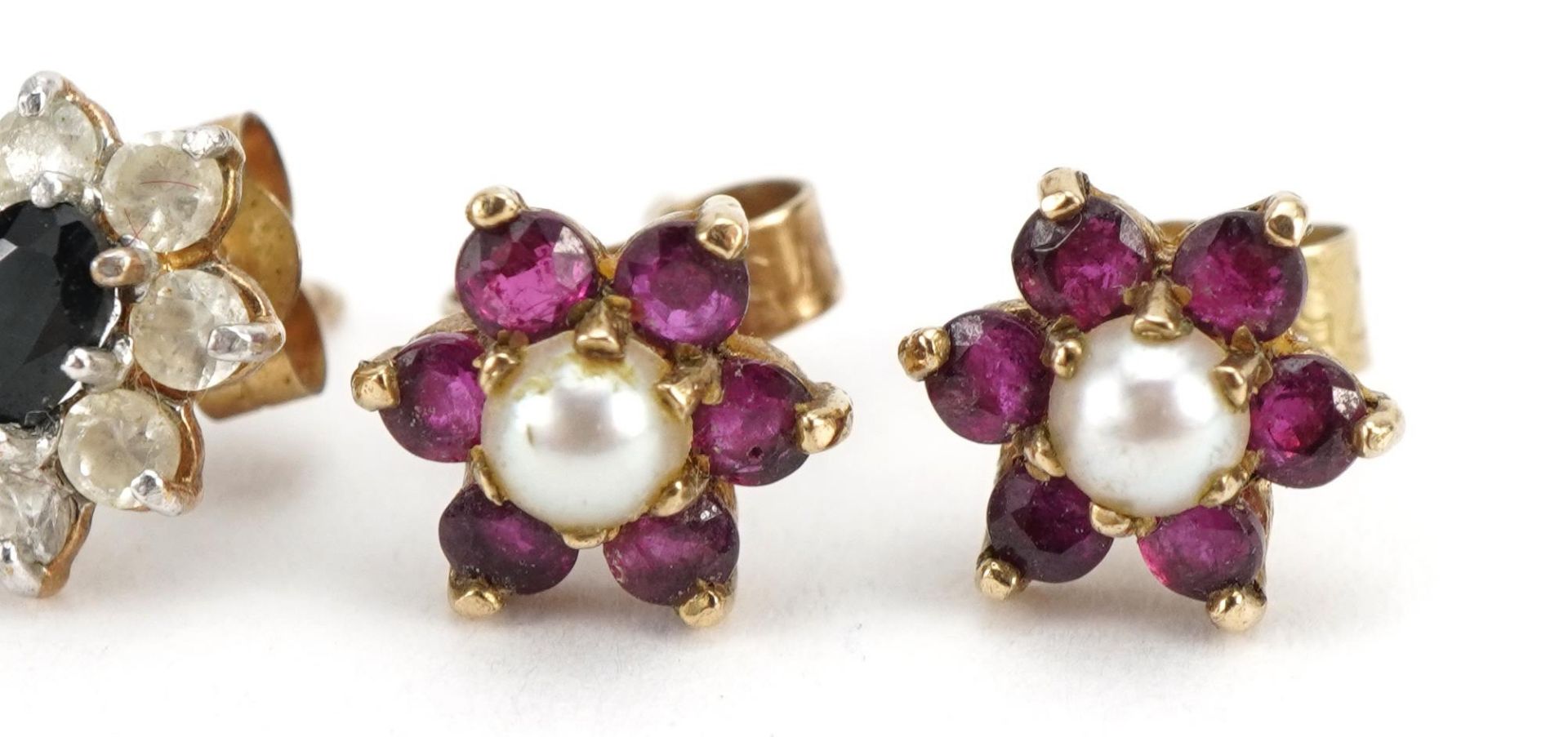 Two pairs of 9ct gold stud earrings comprising sapphire and clear stone and ruby and pearl, the - Image 3 of 4