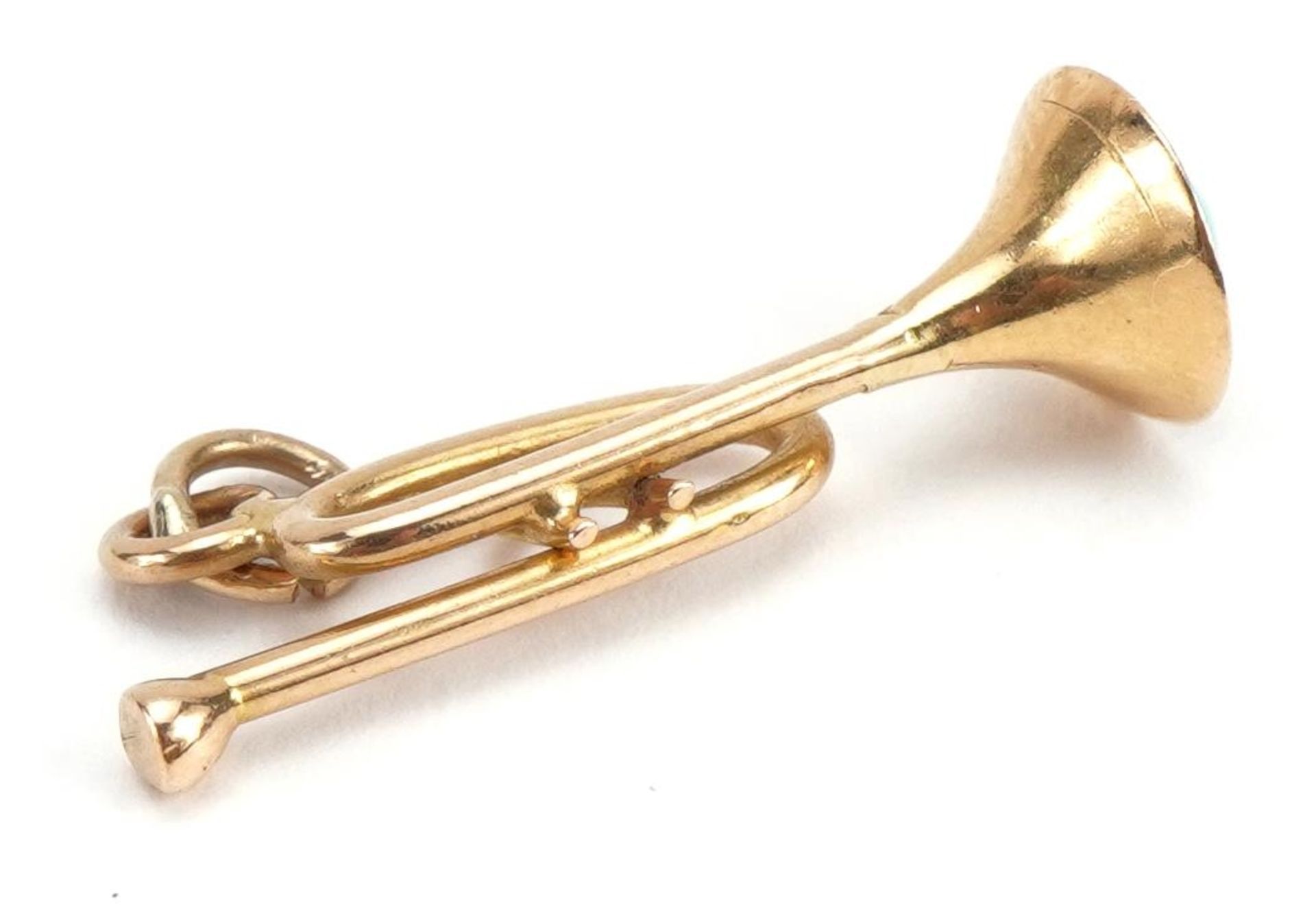 Gold trumpet charm set with a cabochon turquoise, indistinct gold mark, 2.6cm high, 2.0g : For - Image 2 of 2