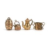 Four 9ct gold charms including gunpowder barrel, teapot and kettle, the largest 1.4cm high, total