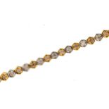 18ct two tone gold diamond line bracelet, 19cm in length, 9.4g : For further information on this lot