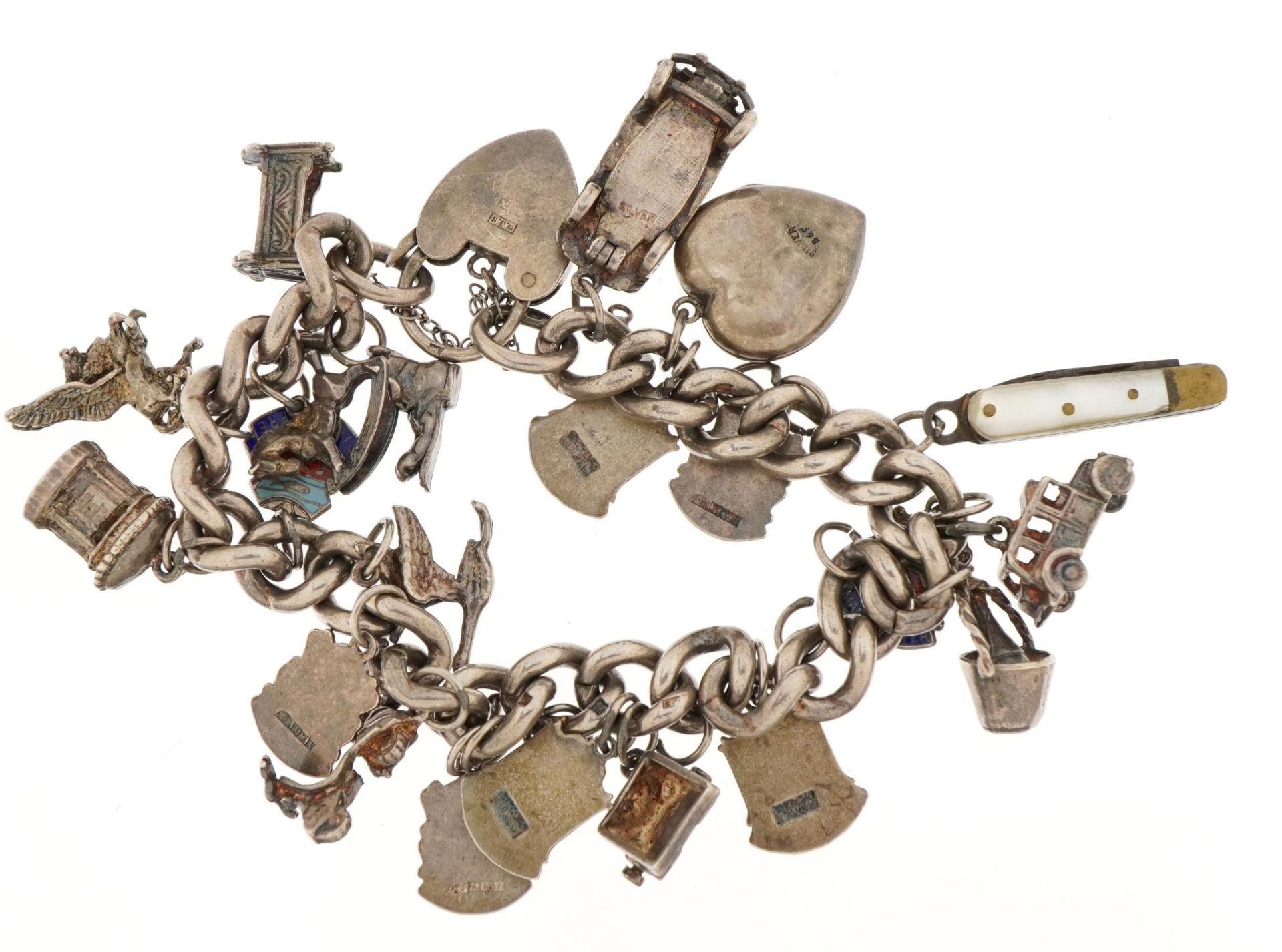 Silver charm bracelet with a selection of mostly silver and some enamel charms including opening - Image 2 of 4