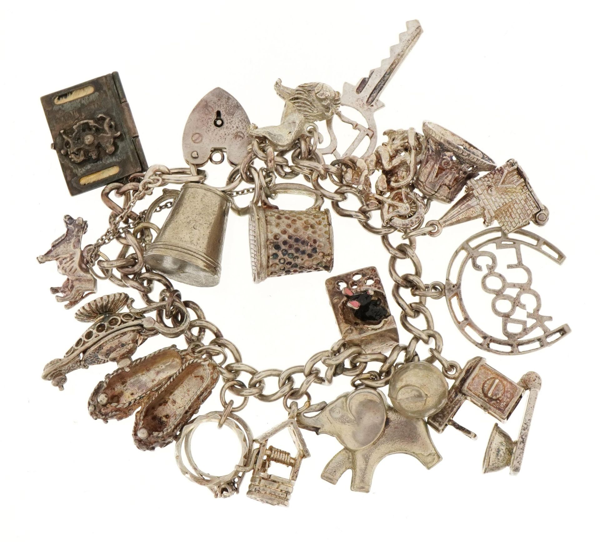 Silver charm bracelet with a selection of mostly silver charms including enamelled mouse and cheese,