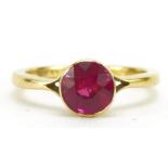 18ct gold ruby solitaire ring, the ruby approximately 5.6mm in diameter, indistinct hallmarks,