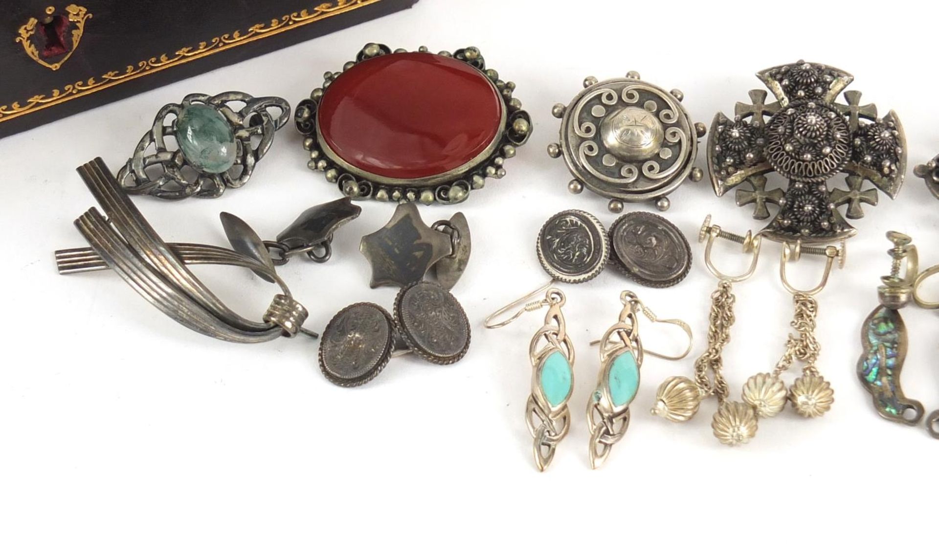 Silver and white metal jewellery housed in a Victorian tooled leather box, including brooches, rings - Image 3 of 10