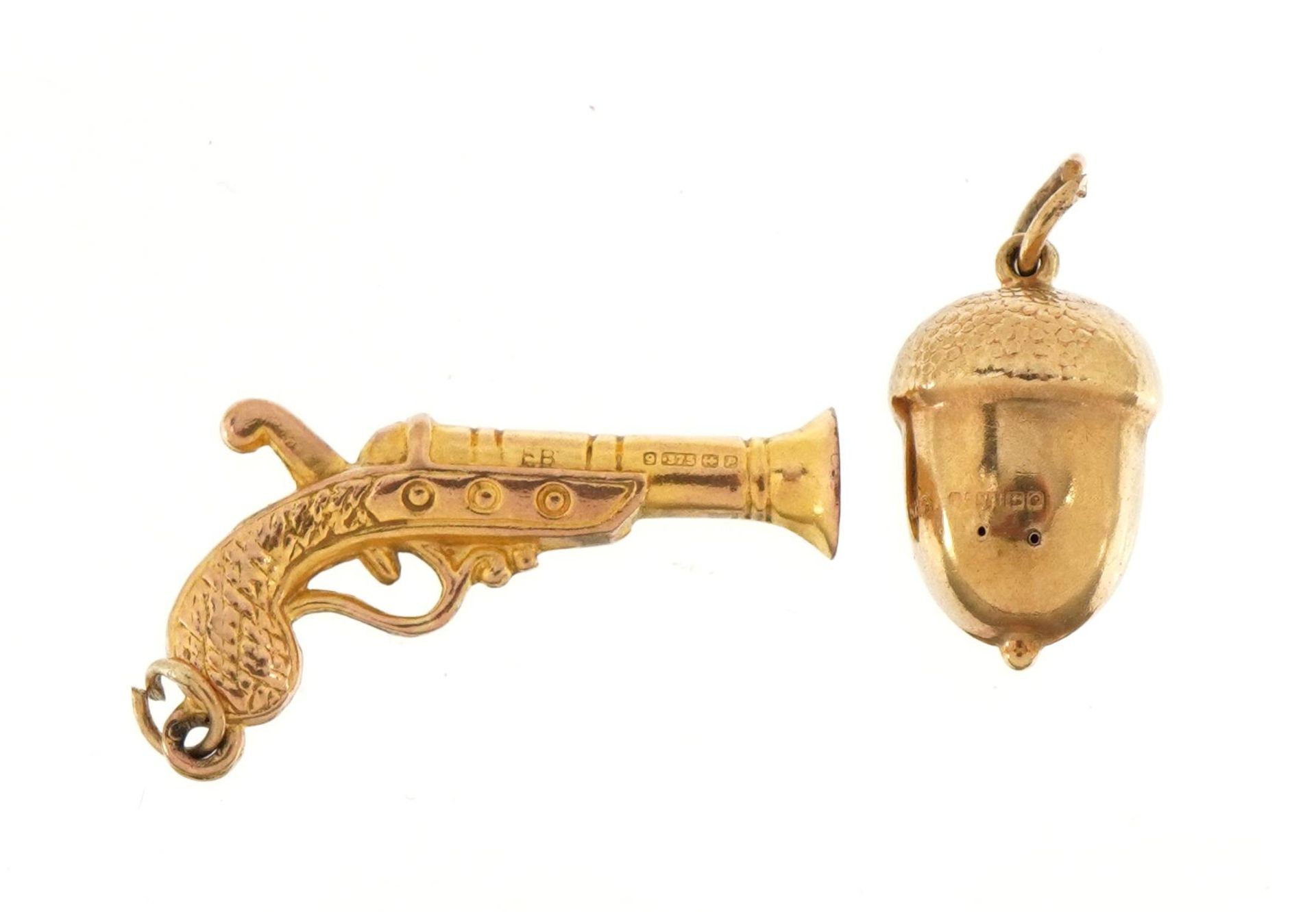 Two 9ct gold charms comprising acorn and pistol, the largest 2.6cm wide, total 1.7g : For further - Image 2 of 3