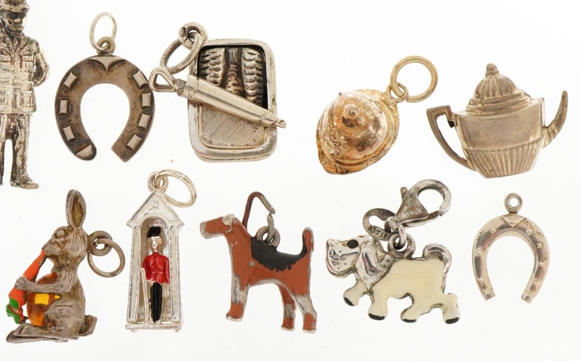 Fifteen silver charms, some enamelled, including Royal Guard in Sentry box, sardine can, dogs and - Image 4 of 7