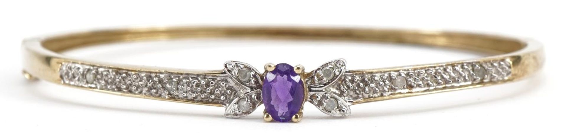 9ct gold diamond and amethyst hinged bangle, the bracelet stamped 0.10 carat, 6.3cm wide, 7.4g : For