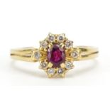 18ct gold ruby and diamond cluster ring, the ruby approximately 5.0mm x 3.9mm, size S/T, 4.0g :