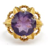 9ct gold amethyst solitaire ring in the form of a flower, the amethyst approximately 12.0mm in