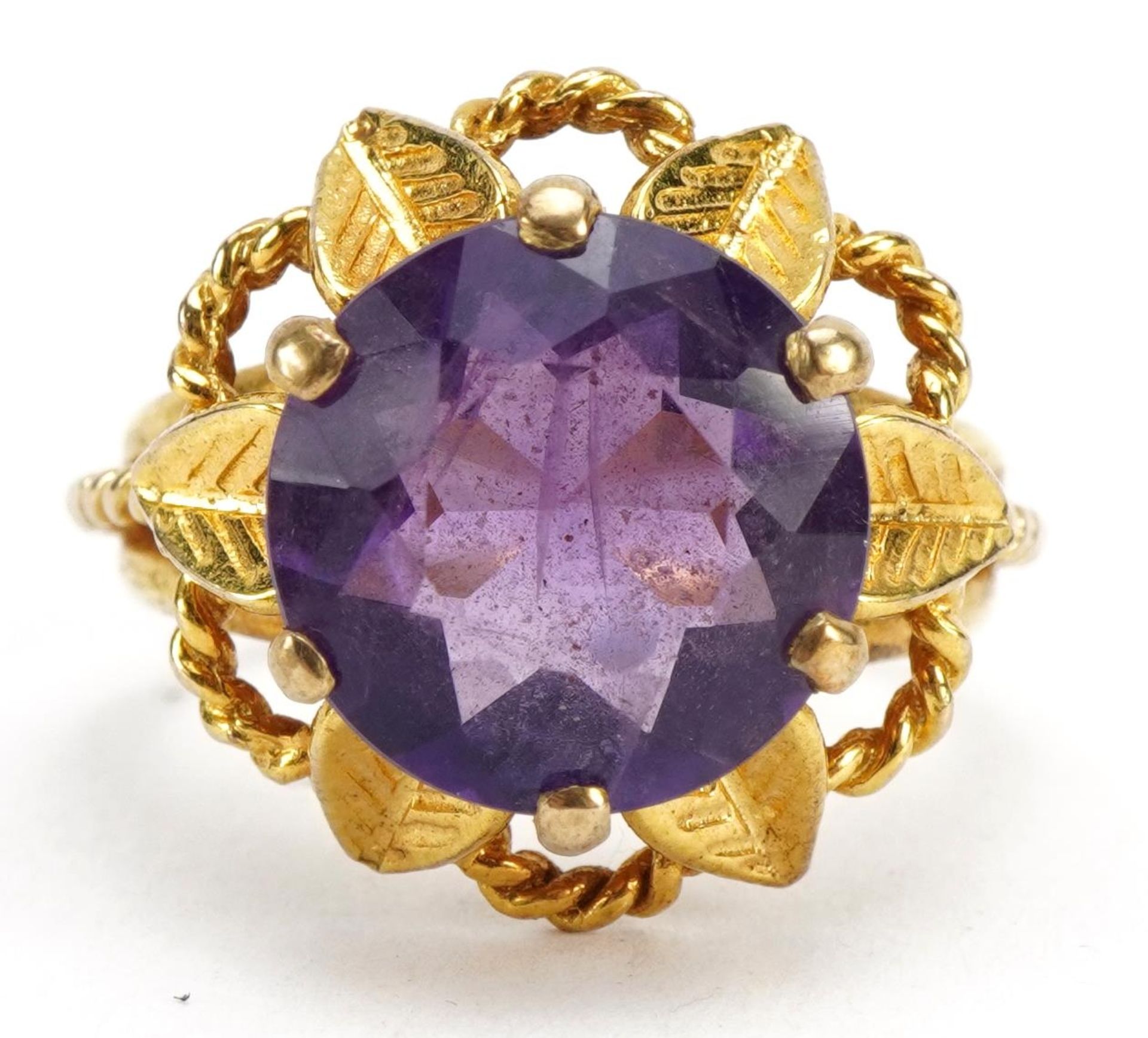 9ct gold amethyst solitaire ring in the form of a flower, the amethyst approximately 12.0mm in