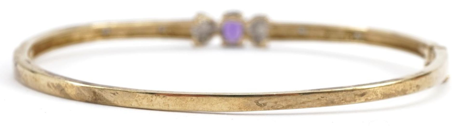 9ct gold diamond and amethyst hinged bangle, the bracelet stamped 0.10 carat, 6.3cm wide, 7.4g : For - Bild 2 aus 3