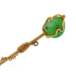 Unmarked gold green hardstone and pearl stickpin with chain, housed in a tooled leather box, 7.3cm