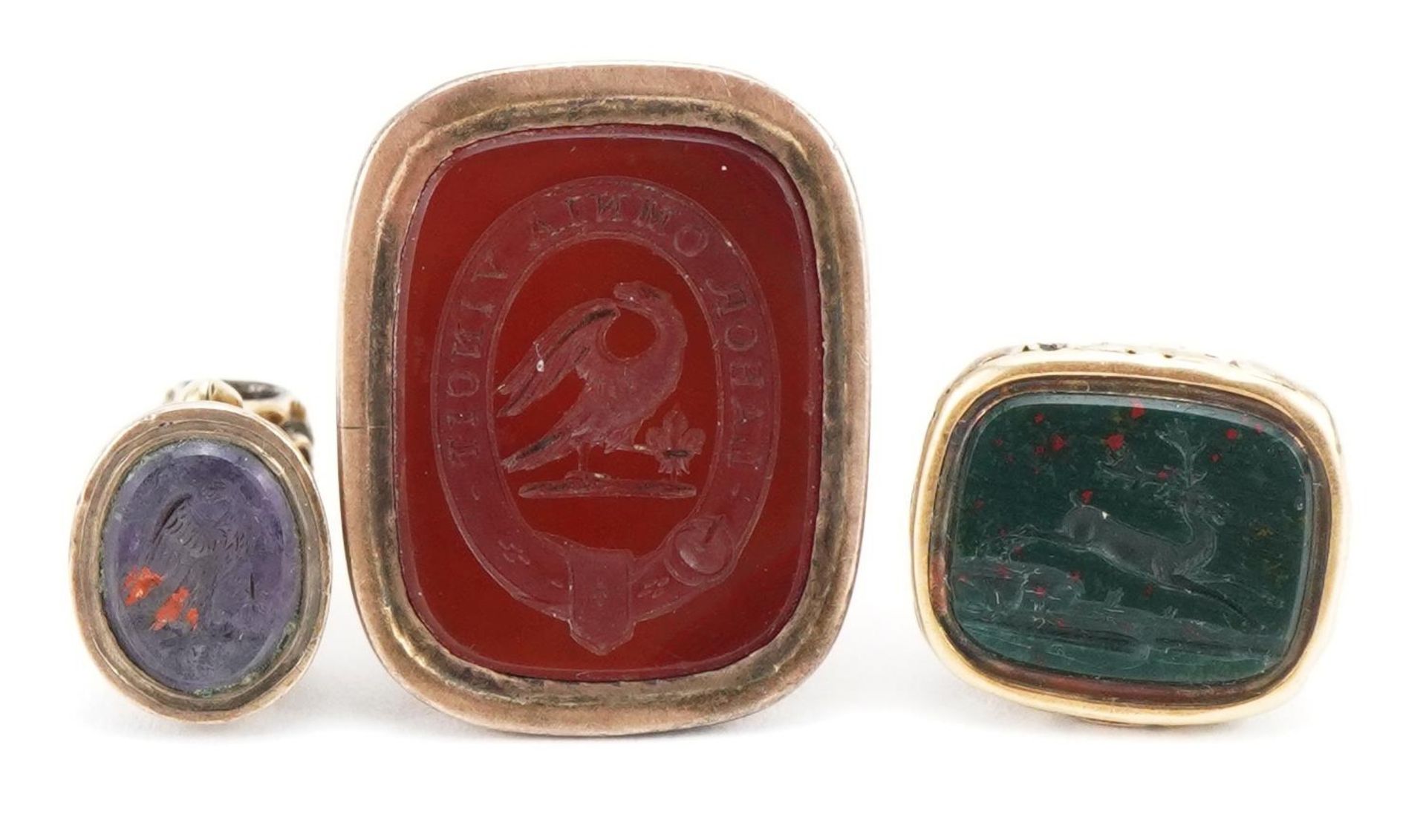 Three antique unmarked gold intaglio seal fobs on an Georgian unmarked gold split ring, each tests - Image 4 of 4
