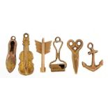 Six 9ct gold charms including scissors, guitar, anchor and shoe, the largest 2.2cm high, total 3.