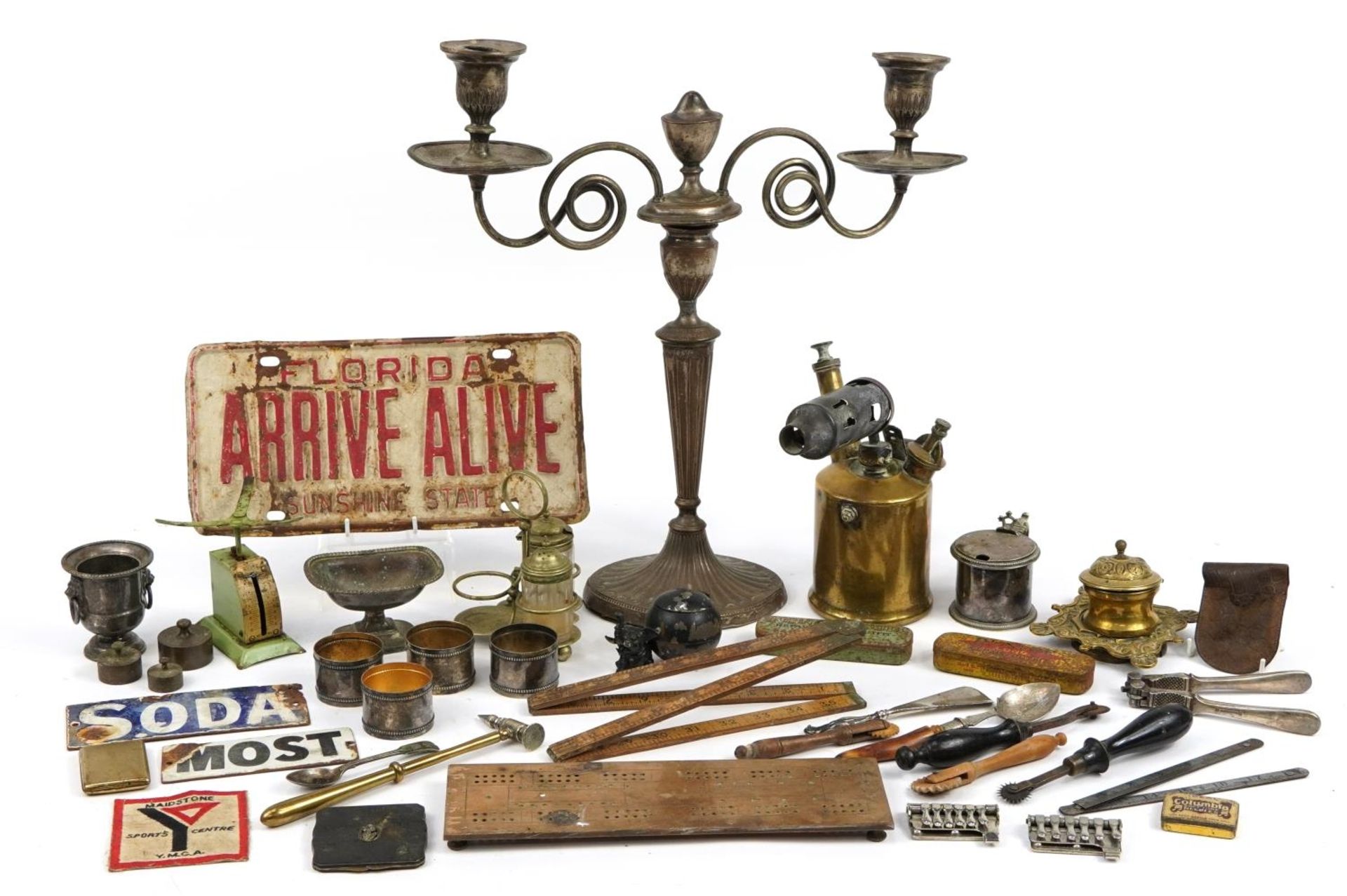 Antique and later metalware including silver plated three branch candelabra, enamelled signs,