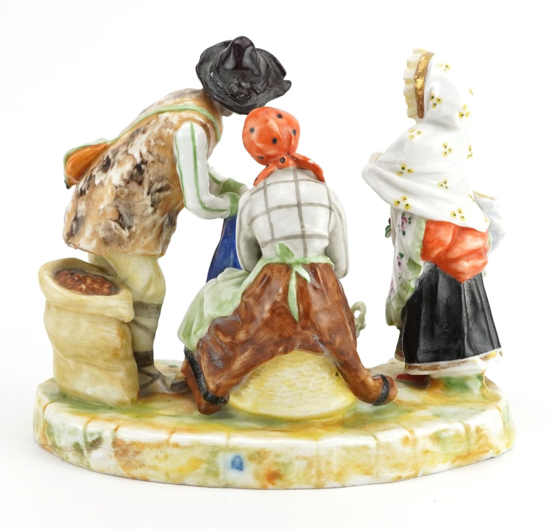 Austrian porcelain figure group of two peasants and a female holding a bag with flowers, 19cm wide : - Bild 2 aus 3
