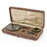 Victorian brass magnifying glass with hardwood handle and a monocular housed in a silk and velvet