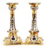 Pair of Royal Crown Derby Old Imari pattern candlesticks numbered 1128, each 27cm high : For further