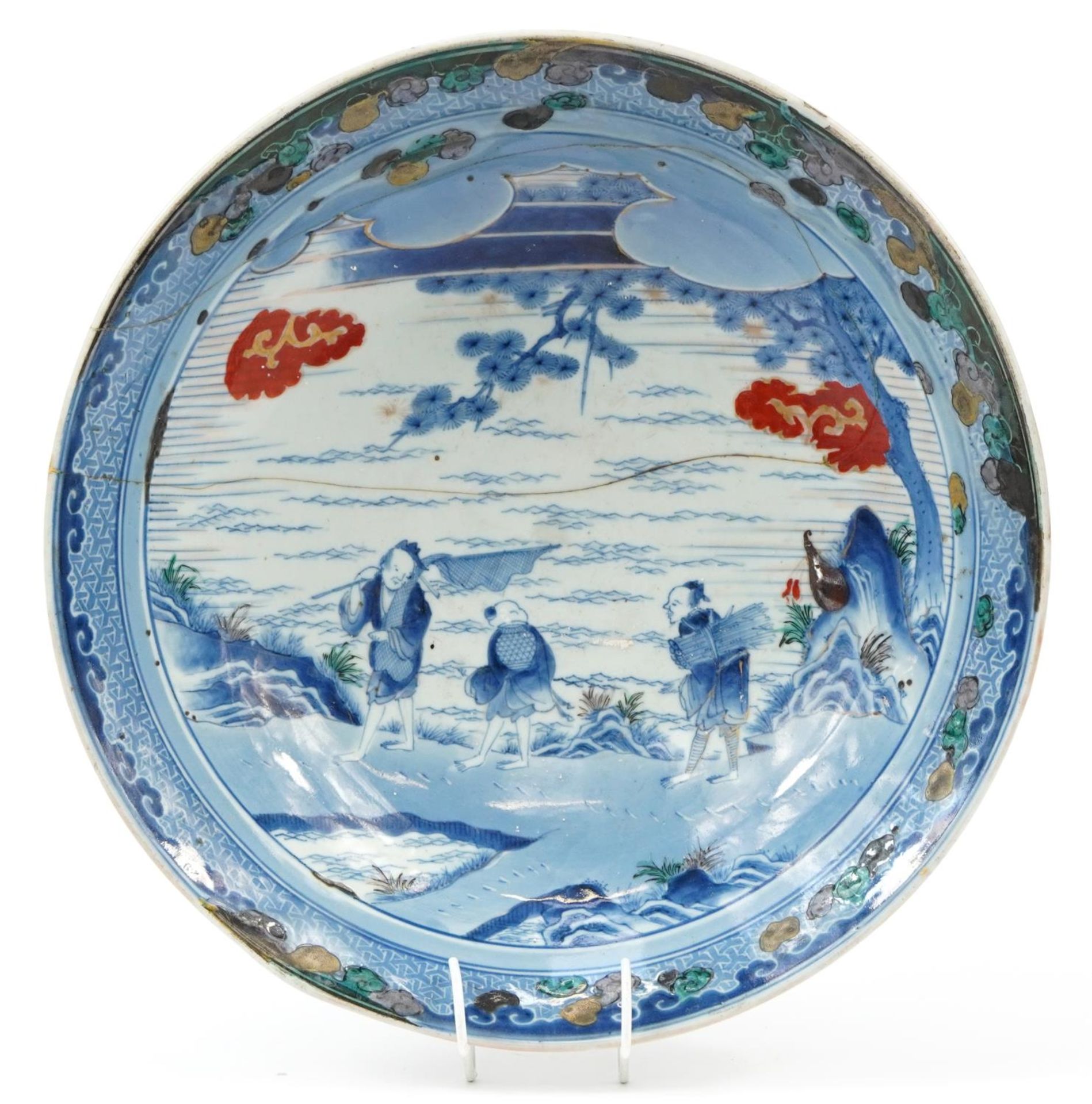 Chinese blue and white porcelain shallow bowl decorated in low relief and hand painted with