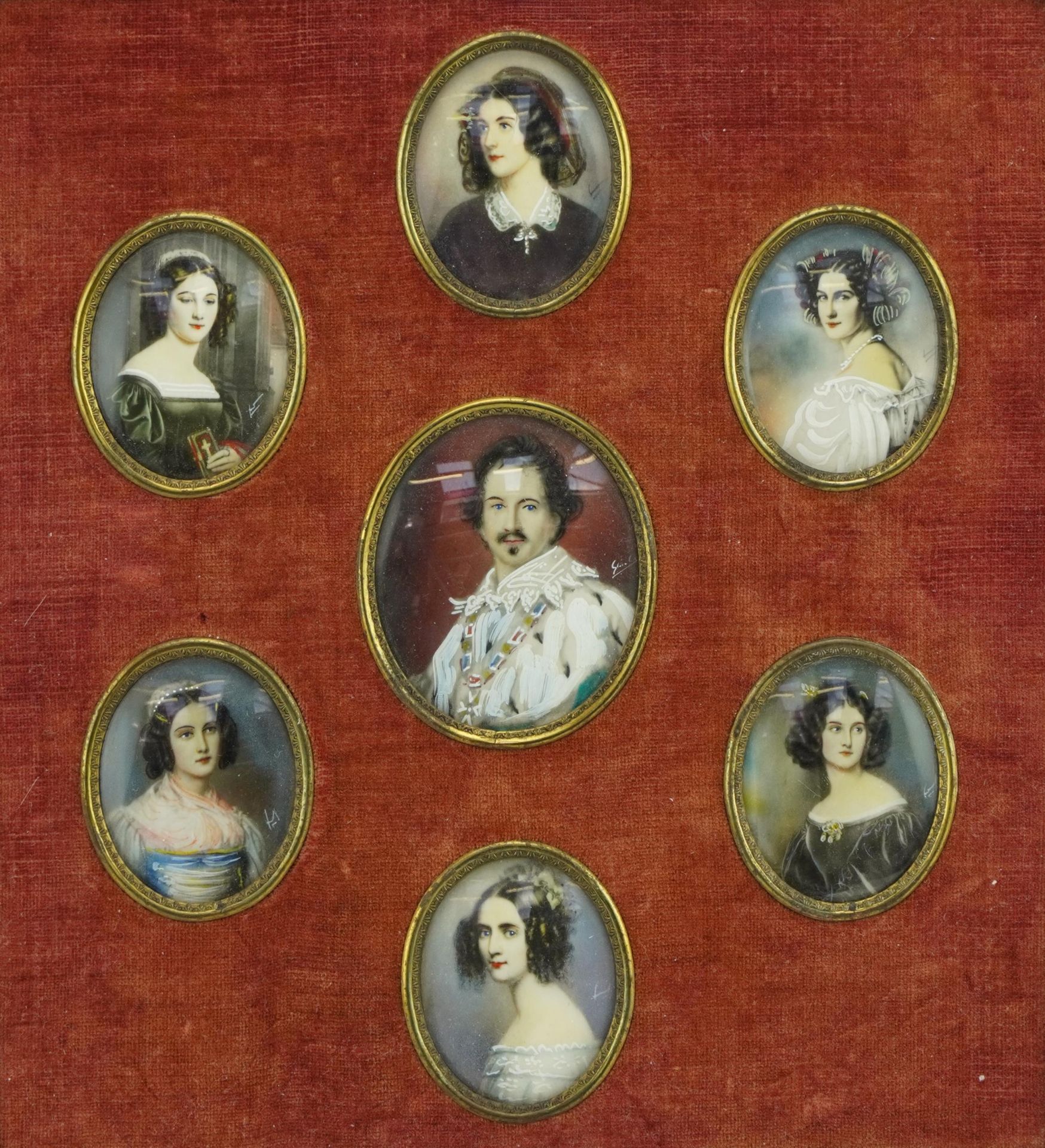 Framed display of seven oval portrait miniatures of Konig Ludwig I and six females housed in an