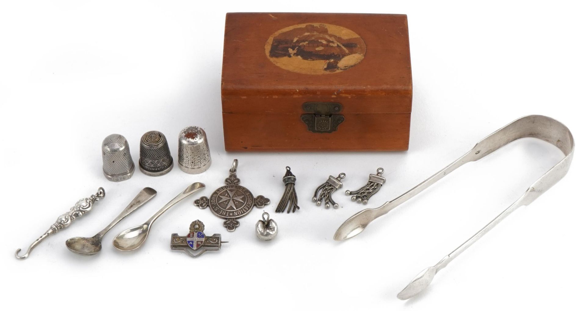 Georgian and later silver objects including a pair of George IV sugar tongs, miniature buttonhook,