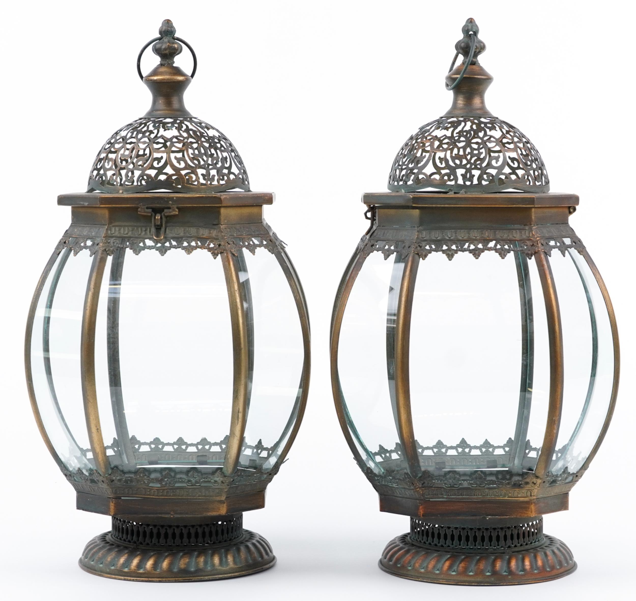 Pair of bronzed metal and glass hanging lanterns, 52cm high : For further information on this lot