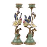 Pair of antique style porcelain and bronze candlesticks in the form of a birds on branches with