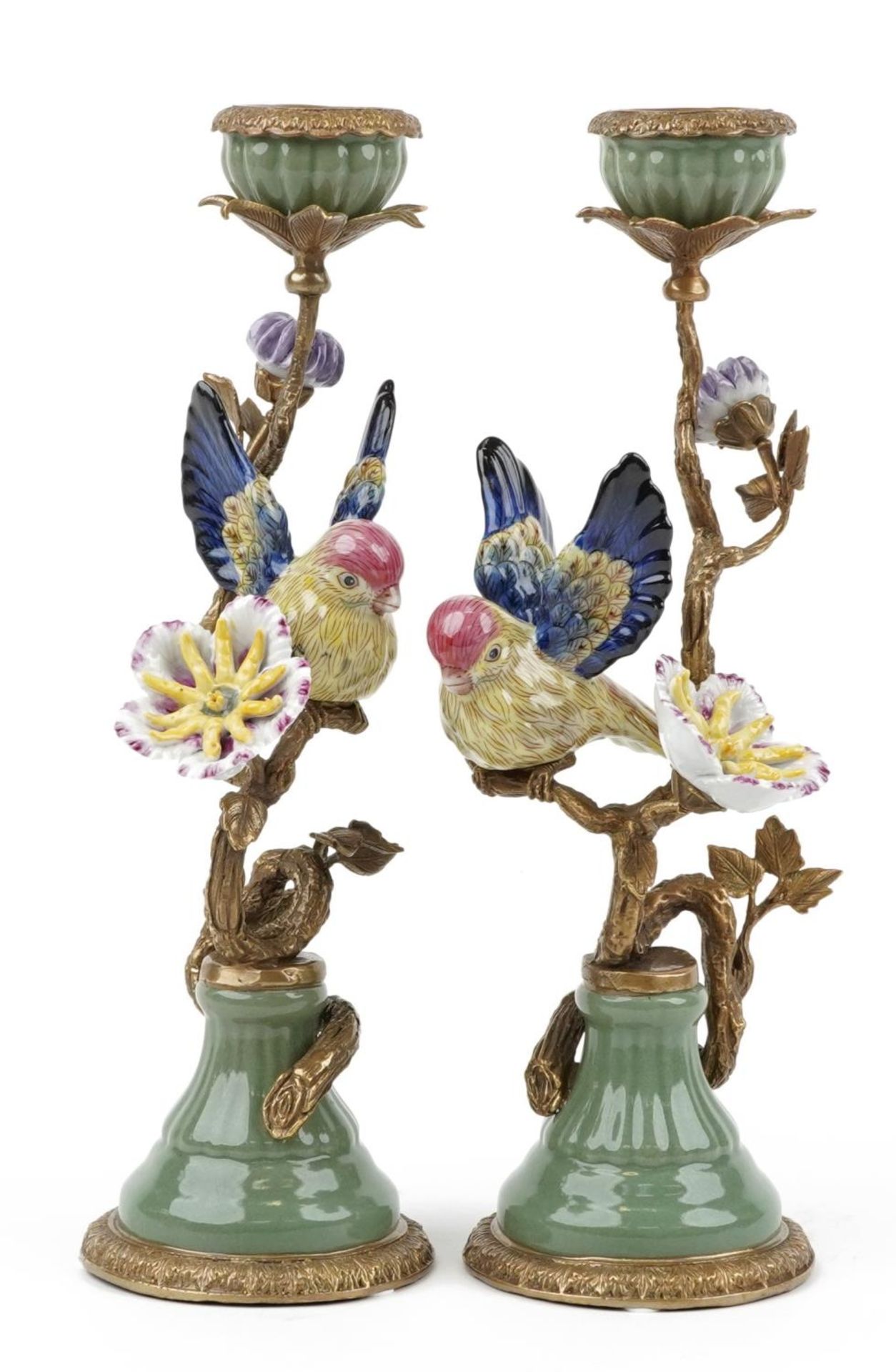 Pair of antique style porcelain and bronze candlesticks in the form of a birds on branches with