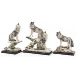 Giuseppe Armani for Nocturne, three large wolf groups raised on simulated burr wood bases, the