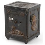 Antique cast iron miniature combination safe decorated in relief with busts and a dog, 15.5cm H x