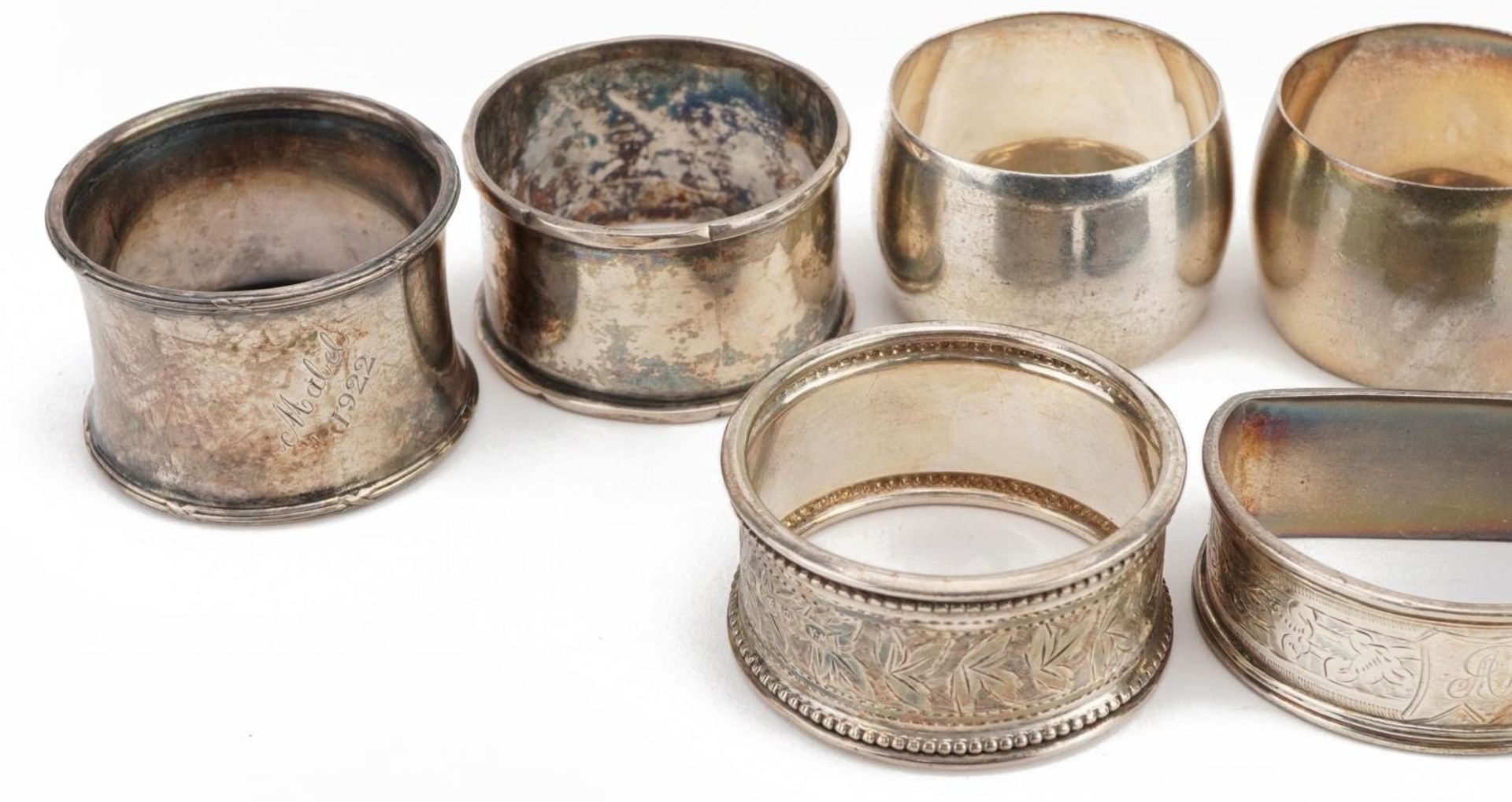 Seven Victorian and later silver napkin rings and a sterling silver thimble cup, the largest 5.5cm - Image 2 of 4