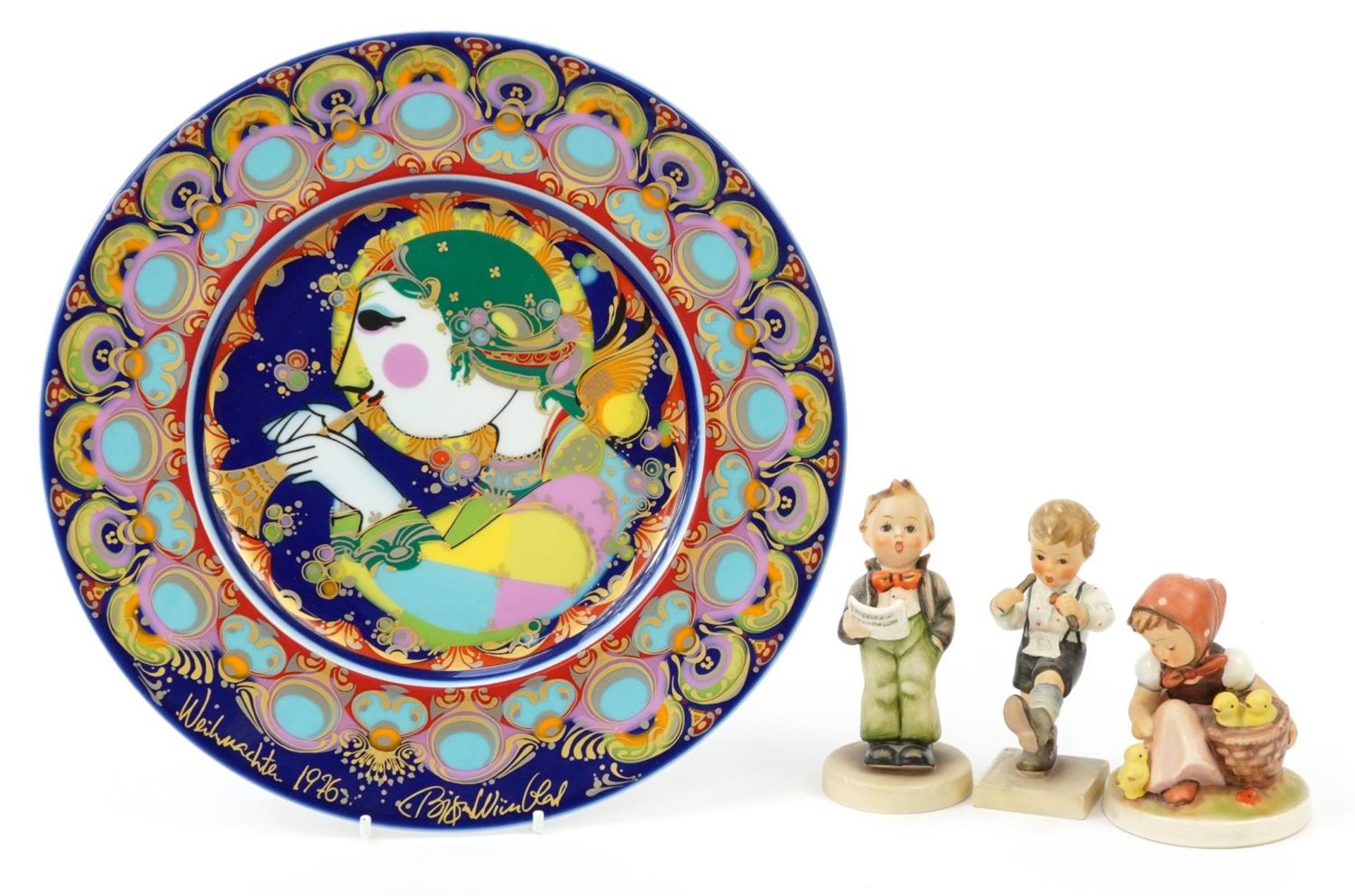 Two Goebel Hummel figures and a Rosenthal Galerie plate signed by Bjorn Wiinblad, the largest 29cm