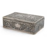 Rectangular Dutch 930 grade silver casket with hinged lid embossed with figures and a dog amongst